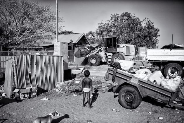 Meah, (5) standing outside her family home. Recently, the Premier of
Western Australia, Colin Barnett, committed to closing down approximately
150 remote Aboriginal Communities in WA. Kennedy Hill, Broome, Western Australia. 
© Ingetje Tadros/Diimex.