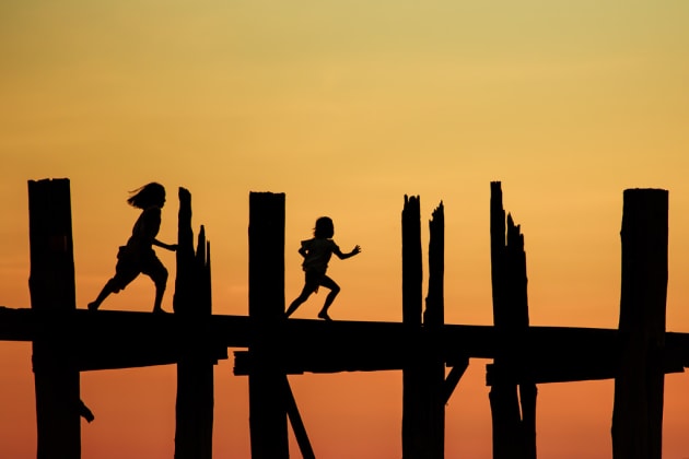 Two young children run across U Bein Bridge at sunset in Mandalay, Myanmar. This was the perfect opportunity to capture interesting silhouettes of people crossing the river on their way home from work/school. Timing the moment when the kids passed by the pillars was the challenging part. I didn’t want them to be obscured by the pillars. By waiting for the right moment helped divide the image into sections for a cleaner composition. Canon 6D, 70-200 f/2.8 @ 200mm, 1/640s @ f4.5, 200 ISO, handheld from a boat on the river. Contrast, saturation and colour balance adjusted in Adobe Lightroom.