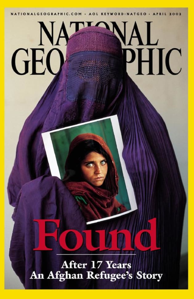 Sharbat Gula holds her portrait on the April 2002 cover of National Geographic magazine. Picture: AP Photo/National Geographic Society, Steve McCurrySource:AP