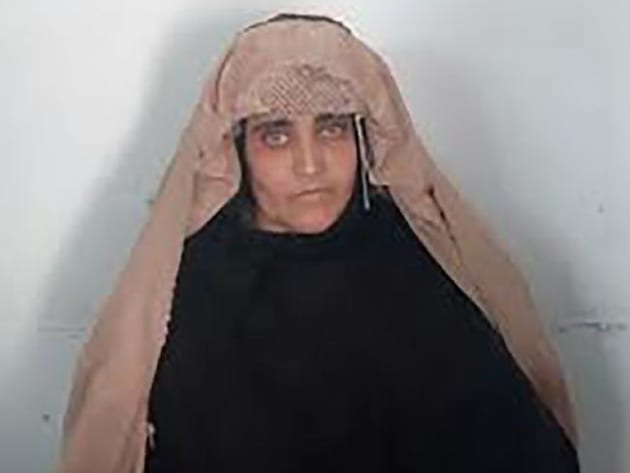 Sharbat Gula, the 'Afghan Girl', awaits her court hearing in Peshawar. Picture: AFP/FIASource:AFP