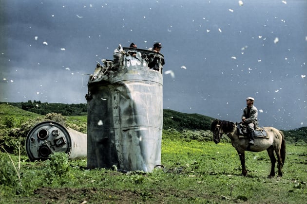 Altai Republic, Russia. 2000. (Alternate Take) © Jonas Bendiksen/Magnum Photos. “I’ve always tried to follow Capa’s adage about getting closer. The irony is that my most well-known image of a crashed spacecraft with butterflies was taken from afar with a big, long telephoto lens. Without that, the butterflies would be all but invisible in the image. I did, in fact, try some images with a wide angle lens, but the pictures just got worse and worse the closer I got. This is an outtake that’s about 10 frames after the more well-known image.