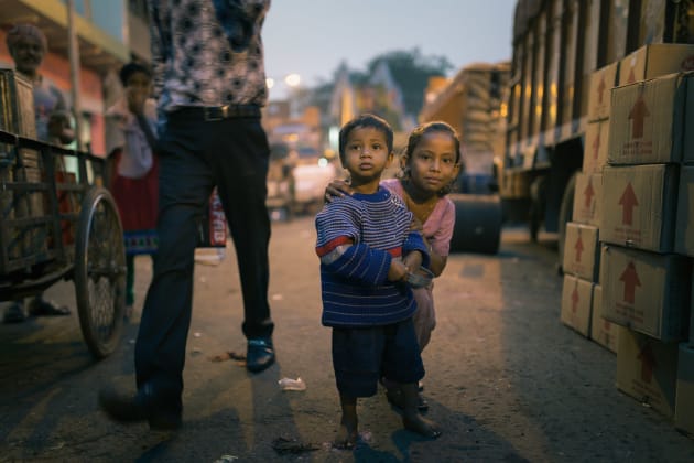 Two young children intrigued by my camera as I walk through a bustling street in Kolkata, India. This shot was taken on dusk so my ISO was high. Converting to colour was more forgiving of digital noise that was evident in the original colour file. Fujfilm X100S, fixed 35mm f2 @ 35mm @ f/2, 400 ISO. Monochrome conversion, contrast and clarity adjusted in Adobe Lightroom.