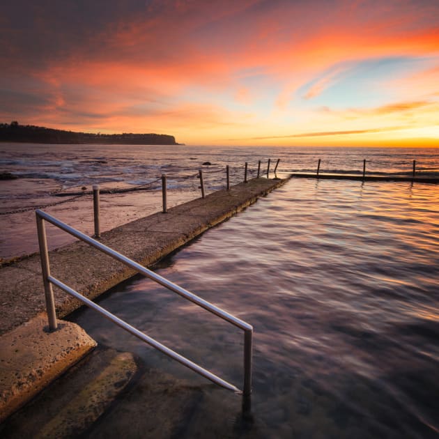 Newport Pool, Northern Beaches, Sydney, NSW. There’s not many things more gratifying to a seascaper than when the sky erupts into vivid red and pink colours on a sunrise. This happened to me on this morning at Newport pool. I decided to use the pool railing to help frame the scene and used a shorter shutter speed to keep some texture in the water. This also helped me later capture images of the swimmers as they moved across the pool. Sony A7R, Canon 17mm TS-E f/4L, 1/10 sec @ f/11, ISO 100, tripod.