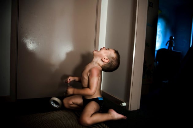 “He’s full on. The paediatrician reckons he has challenging behaviour.” Mikah screams for his mother at the bathroom door. © Raphaela Rosella.