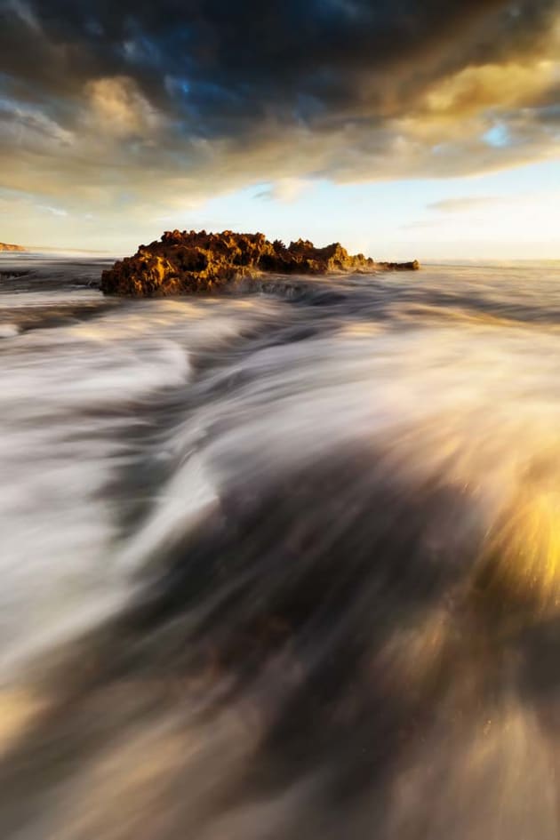 Don’t be afraid to get a little wet as long as it’s safe to do so. Getting in amongst the flow of the tide brings the viewer right into the scene. For this shot, taken at Dragons Head Rock, Mornington Peninsula, Victoria, I somehow managed to get my pants wet, even though it was low tide at the time. A six-stop neutral density (ND) filter helped me reduce the shutter speed to capture the movement of the water as it rushed around my feet. Canon EOS 5D Mark III, 16-35mm f4L lens, 3.2s @ f/8, ISO 50, tripod.