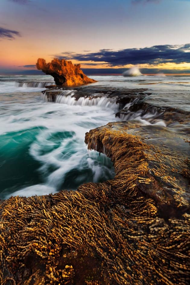 Having some great foreground interest really adds to the feel of the environment. Get your depth of field (DOF) right by closing the aperture and use your DOF preview button. Focus on what is important, like the flora here at Dragons Head rock on the Mornington Peninsula. Even focusing a metre or two in front of you should give you a large DOF at f/8 or higher. Canon EOS 5D Mark III, 17-40mm f4L lens, ½s @ f/8, ISO 50, tripod.