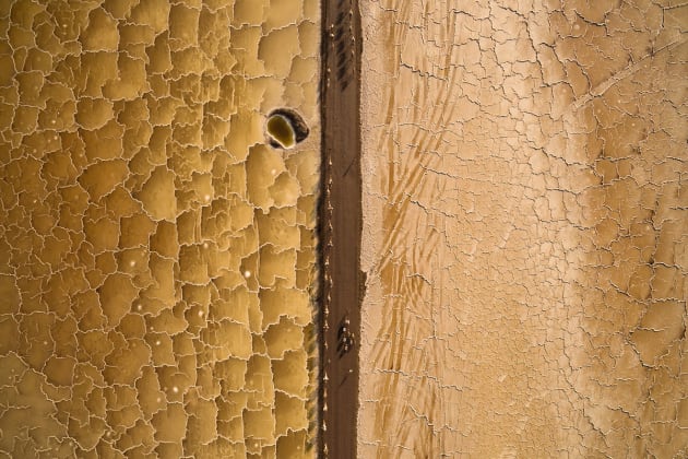 © Joel Santos, Portugal. Winner, Travel Photographer of the
Year 2016. 
Salt Desert, Danakil Depression, Afar,
Ethiopia.
This unique aerial photo shows the salt
miners guiding a dromedary and donkey
caravan through this desert's unique salt
patterns.
