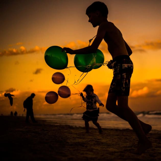 Sunset, children, beach by Tatiana Wood