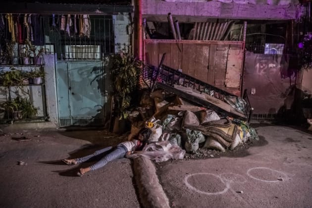 The body of Erika Angel Fernandez lies in the street after being gunned down (together with Jericho Camitan) by masked men in the early hours of the morning, in Quezon City.