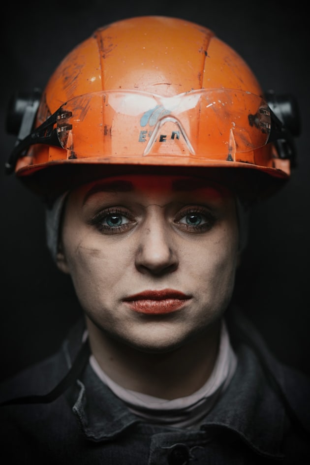 © Roman Shalenkin. Worker, Coal Factory, Russia. This is 28-year-old Alyona who works in a coal factory. When I spoke to her she said that everyone always asks why she works in such a dark, damp, dirty place. ‘It is necessary to have a vocation and this is mine,’ she said. ‘I do not imagine anything else.’
