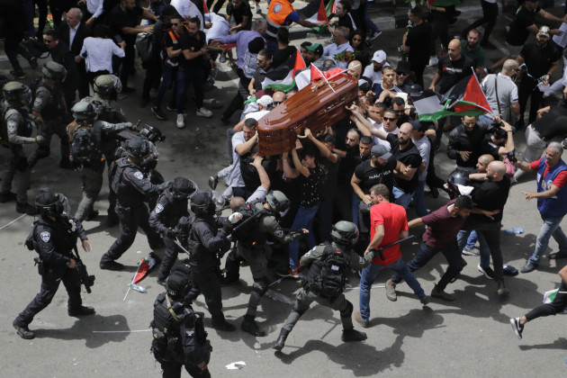 Asia, Singles. Israeli police beat mourners accompanying the coffin of Al Jazeera journalist Shireen Abu Akleh to her funeral, in East Jerusalem, on 13 May 2022. Police prohibited people from carrying the coffin on foot through the city, which is customary for notable deaths, as mourners chanted “We sacrifice our soul and blood for you, Shireen”. Abu Akleh, a veteran reporter of the Palestinian-Israeli conflict, was shot two days earlier while covering an Israeli military raid in Jenin, West Bank. Another journalist was wounded at the scene. After initial denials, the Israeli military has since admitted there was a “high possibility” Abu Akleh was shot by an Israeli soldier. © Maya Levin, Associated Press