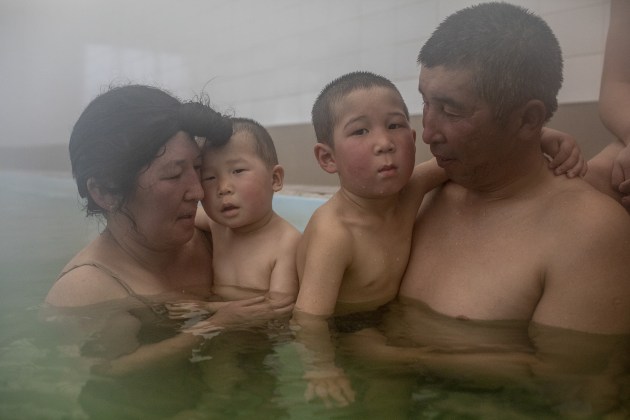 World Press Photo Long-Term Project Award: Battered Waters by Anush Babajanyan, Jaynagul Brjieva and her family enjoy an outing to a hot spring in Kaji-Say, Kyrgyzstan, on March 9, 2021. The waters are thought by some to have healing properties. Anush Babajanyan/VII Photo/National Geographic Society