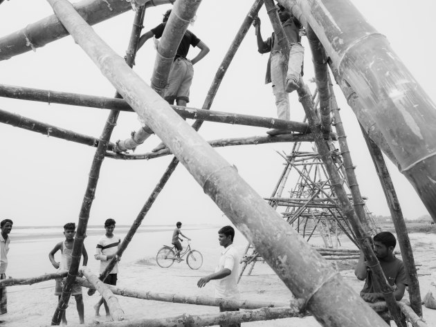 Asia, Honorable Mention. Zishaan A Latif. Indigenous villagers construct bamboo “porcupines” to counter the erosion caused by the Brahmaputra River. These unconventional structures entangle river weeds and reduce soil damage during monsoons. Tarabari, Barpeta district, Lower Assam, 18 April 2023.