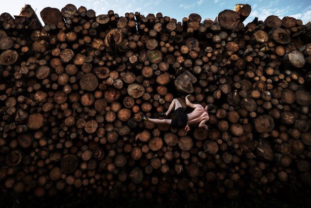 Log Pile Bouldering. © Adam Pretty, Australia, Getty Images. SPORTS - FIRST PRIZE, SINGLES. Georg climbs a log pile while training for bouldering, in Kochel am See, Bavaria, Germany, on 15 September 2020. Bouldering entails climbing on small rock formations and boulders of usually no more than six meters in height, without ropes or harnesses. Historically, it began as a training activity for more ambitious climbing and mountaineering pursuits, but has evolved into a sport in its own right.