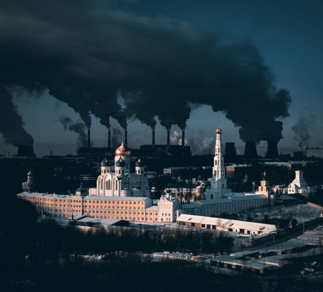 © Sergei Poletaev. Metaphorical Statement About City and Winter. A 500-year-old monastery in the Moscow region and a large power plant in the background. The steam from the cooling towers is particularly dense due to severe frost.