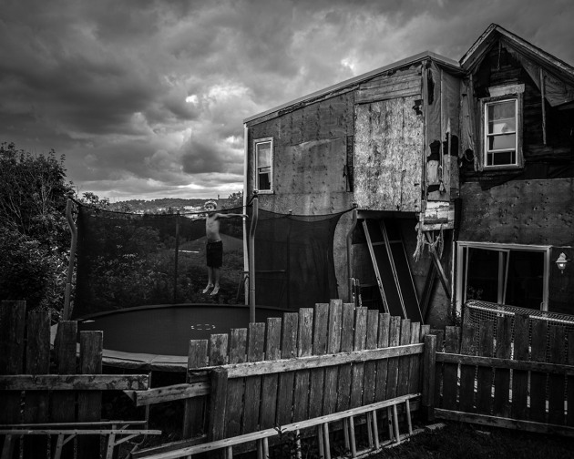 Trey jumps on the trampoline outside of his family home in the Bayside neighbourhood of Saint John. © Chris Donovan