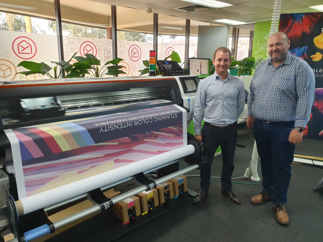 Strong partnership: Morgan Quinn, Neopost (left) and Jeremy Brew, HP, demonstrate the 1.6m Stitch S500's direct-to-fabric capabilities