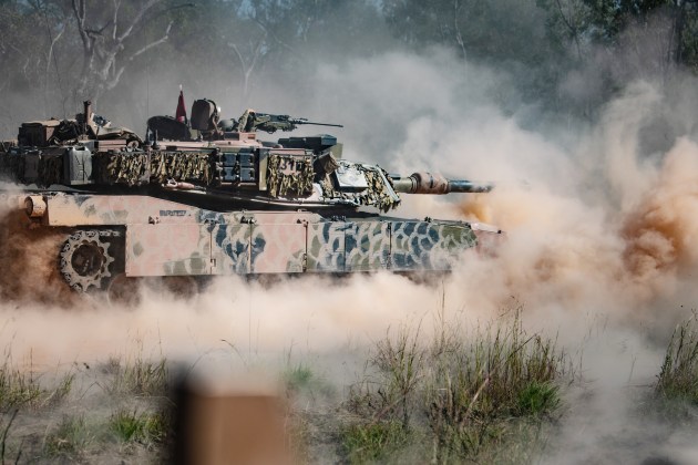 An M1A1 Abrams Main Battle Tank supports soldiers from 6th Battalion, Royal Australian Regiment during an offensive operation live-fire activity. (Credit: Defence)