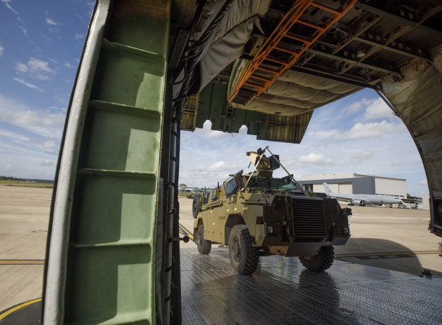 A Bushmaster with an EOS RWS is loaded onto an Antonov aircraft bound for Ukraine. (Defence)