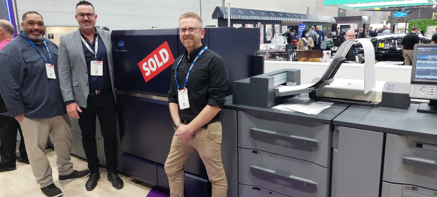 Heading to Hobart: With the new Konica Minolta C14000 bound for Monotone are Stu White (right) Monotone; Colin Johnstone (centre) and Bryce Greaves (left), Konica Minolta
