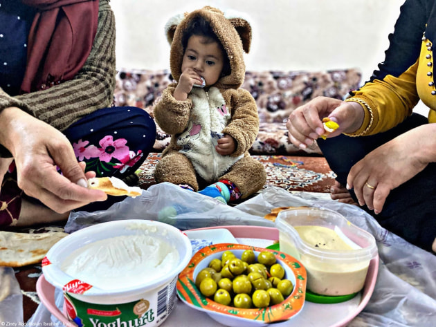 WFP Storytellers Award,	Ziney Abdulhakim Ibrahim, 'Iraq Family'. The importance of all family members meeting around one dining table at least once a day, as this habit helps to strengthen family ties and gives family members a sense of emotional warmth and provides an opportunity for dialogue, exchange of ideas and problem-solving.