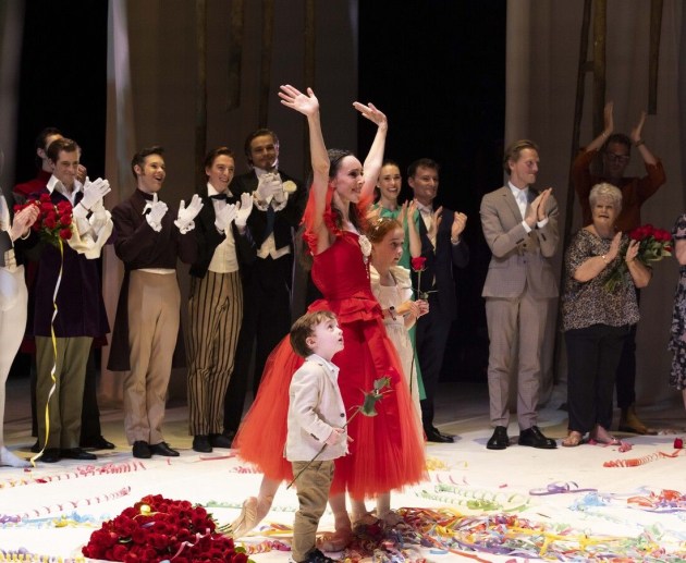 Amy Harris takes her last bow with her children on stage.