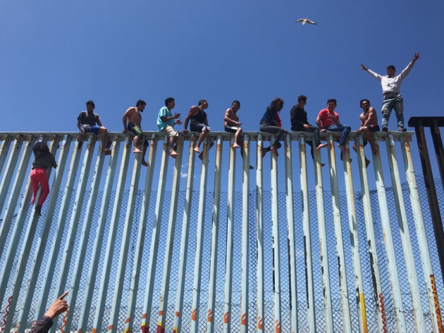 3rd Place – News/Events: Refugee Caravan by Verónica G. Cárdenas, United States
“Members of the Refugee Caravan 2017 climb the border fence dividing Mexico and the U.S. to celebrate their arrival in Tijuana.”
Location: Tijuana, Baja California, Mexico. Shot on iPhone 6S