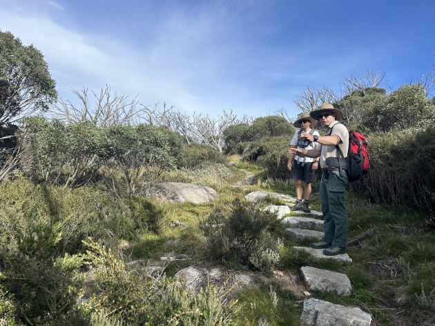 Greg Thomson (right) talks about the track’s construction.