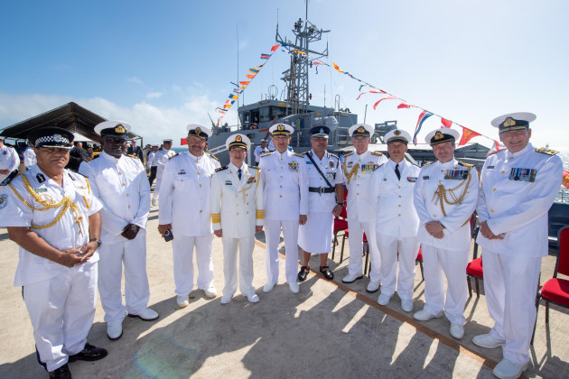 Naval personnel from several nations pose in front of a Tongan GCPB armed with a medium machine gun, 
Credit: Royal New Zealand Navy