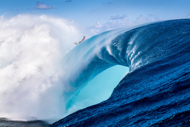 Rodrigo Reinoso, a Peruivan surfer living every surfer's worst nightmare. Over the falls backwards at one of the world's most deadly surf breaks Teahupoo in Tahiti. Image: Ted Grambeau.