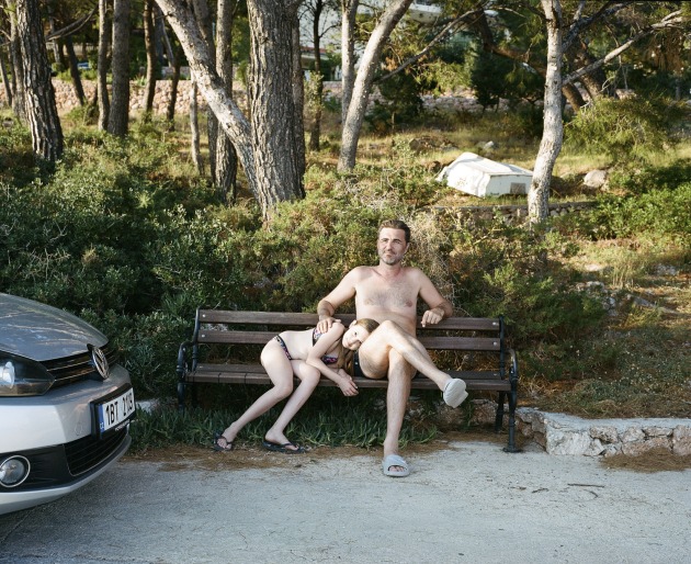 © Alana Holmberg. Portrait of Gabor and Nora, 2019
Locals claim the sunniest place in all of Europe is Hvar Island, Croatia. On the southside of the island, far from the clubs and superyachts of Hvar town, Sveta Nedjeljia exists quietly. I arrived without a plan and stayed for two weeks, sleeping more deeply and photographing more freely than I had for years. On a late afternoon walk I came across Gabor Bunford and his daughter, Nora. Languid as the heat of the day evaporated, their ease with each other reminded me of the endless summers of my childhood. When bodies aching from the sun and the sea folded heavy and content.