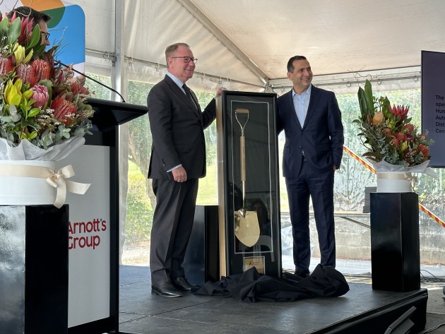 At the official commissioning of Arnott's automated distribution centre at its Huntingwood site in Western Sydney. L-R: Member for Prospect Dr Hugh McDermott and Arnott's CEO George Zoghbi, unveiling the golden shovel presented to the company by FDC Construction and Fitout.