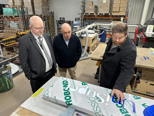 Promoting sign industry: Asga president Mick Harrold (right) shows Chris Hudson (elft) and Philip Clarke how signs are manufactured