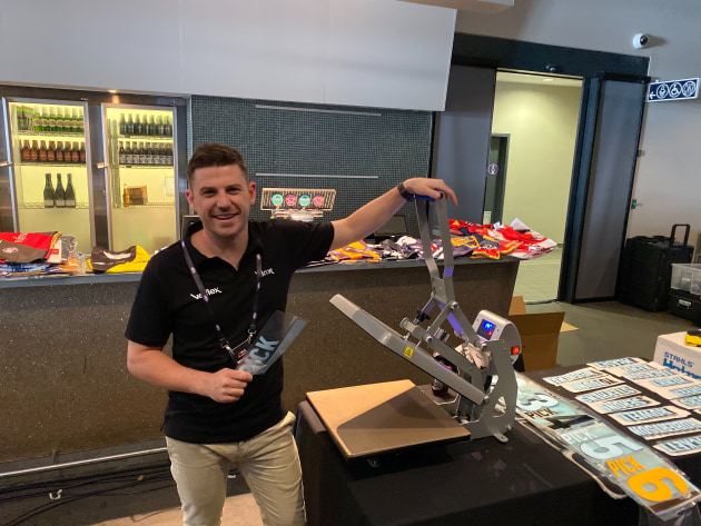 Less than a minute: Velflex CEO Ben Carroll printing shirts at the AFL Draft