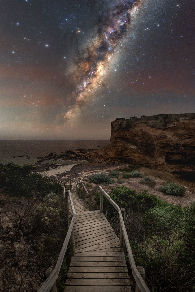 © Blntpencil - “The Forgotten side of Kanagaroo Island” 
Baudin Beach, Kangaroo Island, Australia
This image was captured at Baudin Beach on Kangaroo Island. This part of the island was luckily not affected by the devastating bushfires in 2020. It is a capture of the rising Galactic Center floating above the ocean and represents the way of life on the island “where people live at one with nature.”