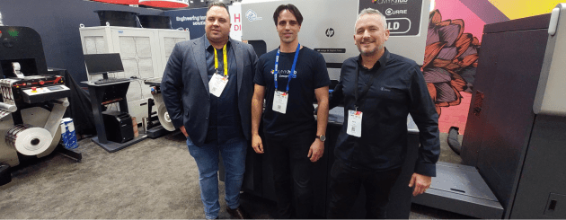 CMYKhub inot labels in September: Trent Nankervis (right) and Dayne Nankervis (centre) from CMYKhub, with Mark Daws, Currie Group in front of a new HP Indigo 6K