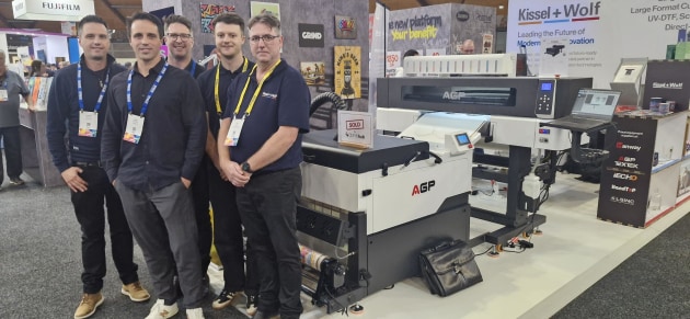 CMYKhub soon to offer DTF film service to resellers: Dayne Nankervis (centre), CEO, CMYKhub at PacPrint as the company orders the printer form Kissel + Wolf