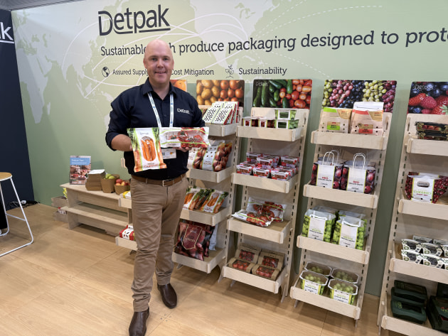 Detpak's Christian Bell shows off the paper-based flowwrap packaging.