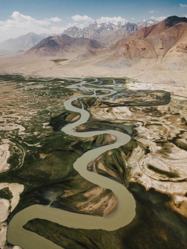 Tajik Serpent. I spotted this river winding its way in eastern Tajikistan. I knew that there could be some abstract patterns but was utterly blown away with what I saw instead. The snaking river leads perfectly towards the peaks in the distance. DJI Mavic Pro. 1/100s @ f/2.2, ISO 166. +0.34EV.