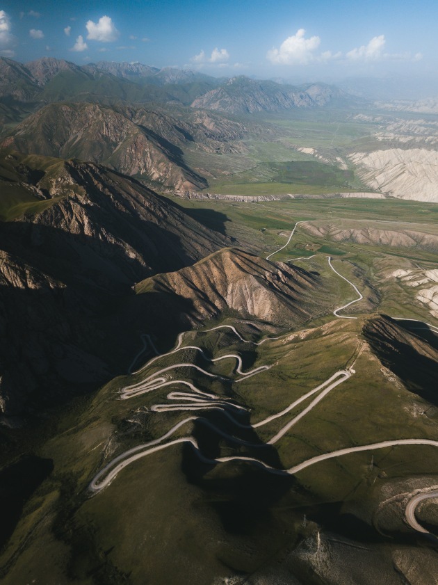 Ak-Baital Pass 4655m, Tajikistan. The second highest highway pass in the world and one that only a handful of crazy truck drivers tackle without acclimatisation. The winding dirt road was the perfect element to break up the bleak surroundings. DJI Mavic Pro. 1/100s @ f/2.2. ISO 131. +0.34EV.
