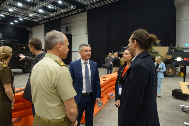 Colonel Robin Smith, Head RICO and Assistant Minister for Defence Matt Thistlewaite speak with Praxis Mabs’ Katie & Cameron Donaldson. (Nigel Pittaway)