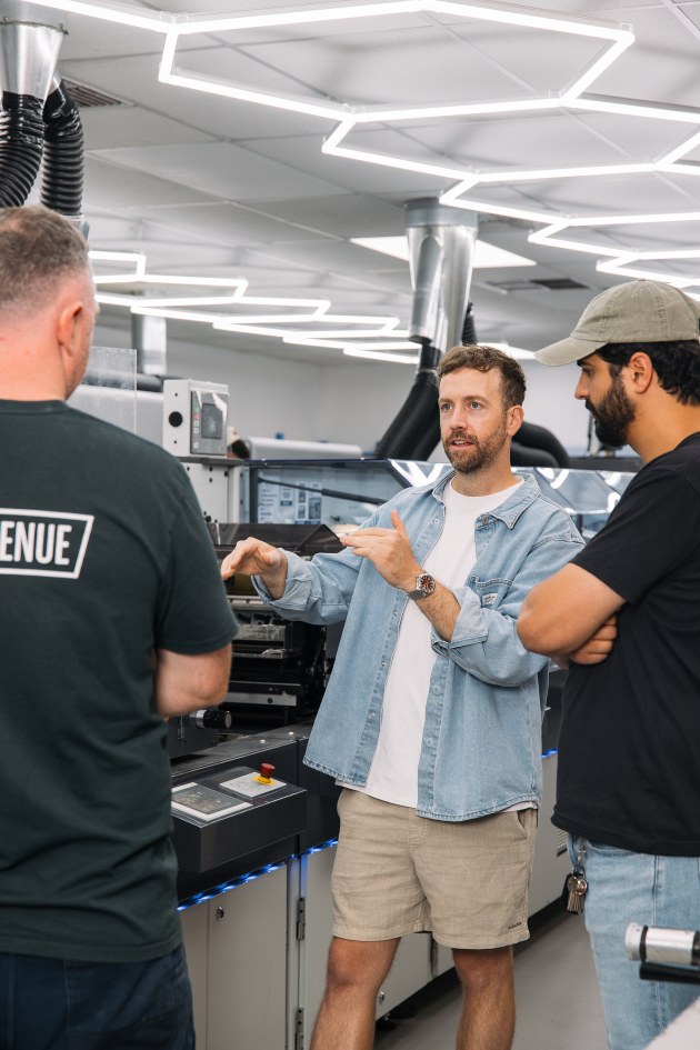 Time for a press check: David Byerlee and James Scarpantoni on the print floor at Label Avenue