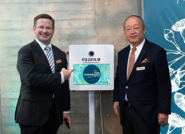 Celebrating 20 years: Mark Coure, shadow minister for Multiculturalism, Jobs, Industry, Innovation, Science and Technology with Fujifilm global CEO Teiichi Goto