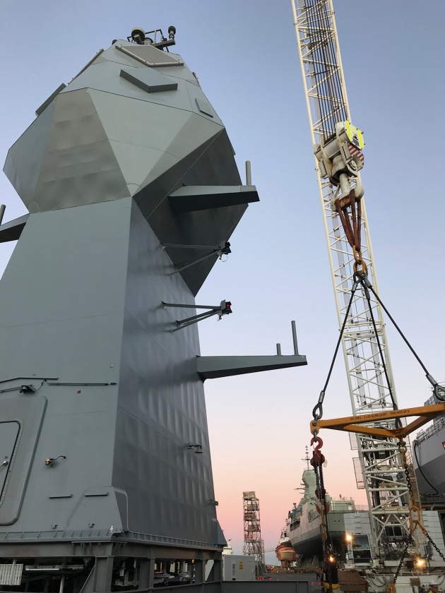 The replacement mast is taller and wider than the existing mast so that it can accommodate the new CEA L-Band radar system. Credit: BAES AUS