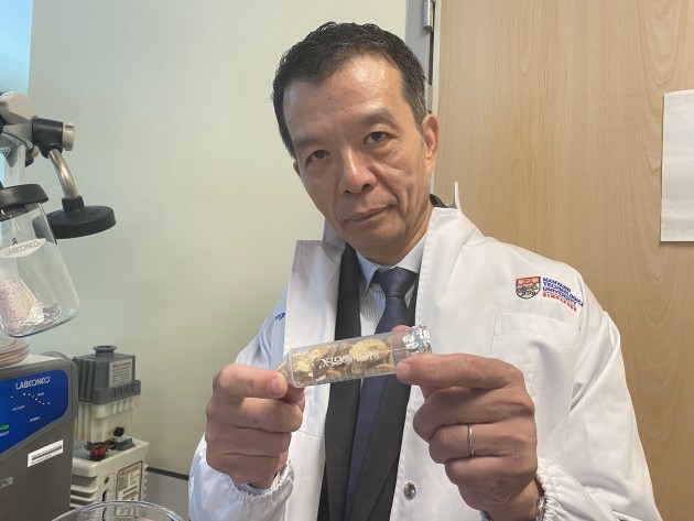 Prof William Chen holding jackfruit seeds that have just been freeze-dried, a step that is part of the NTU-developed method to use them to produce lactic acid.