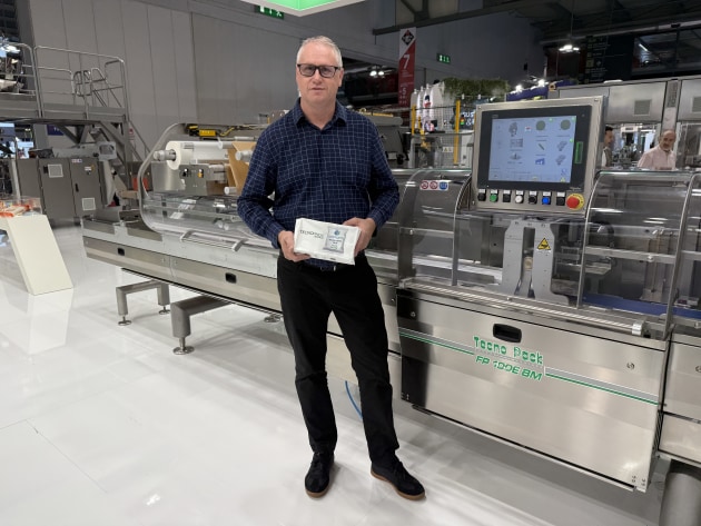 Pacmatic's Ettiene Van Vuuren on partner company Tecno Pack's stand, here demonstrating the paper-based flow wrap packaging system, FP 100E.