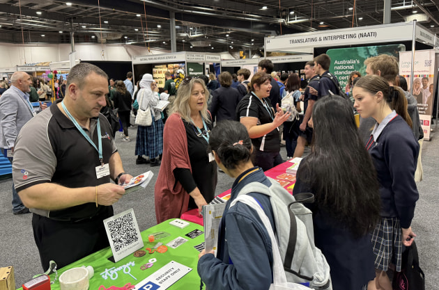 John Watters (AusSip), Sandy Aspinall (Creative Juice SA), and Diana Nikolic (Ball and Dogged) distributing leaflets and encouraging discussions