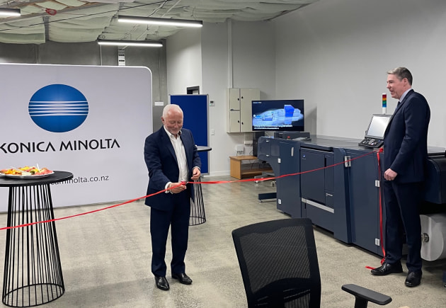 Innovation experience: MIcahel Barnett (centre) and Eric Holtsmark cut the ribbon on the new Konica Minolta New Zealand showrooom