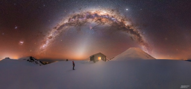 © Larryn Rae - “Mt. Taranaki Milky Way” 
Fanthams Peak, Mt. Taranaki – New Zealand
This is one of the most challenging shots I have ever captured, as it required climbing for 4 hours in 70km/h winds to reach the ice summit of Fanthams Peak – a volcano on the side of Mt Taranaki. At an elevation of 2000 m and -15ºC outside with gusty wind blasts, I had to choose settings that would get me the capture rather than what I may have considered more ideal settings.
I am so stoked to have captured what I did under perfect clear skies, as it was both a true test of both mountaineering and endurance carrying all my gear to this location, but one I will look back on with pride ands success.