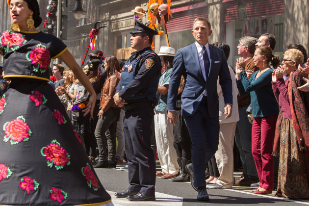 Spectre (2015). Bond (Daniel Craig) following Marco Sciarra through the Dia de los Muertos procession; Tolsa Square, Mexico City. 
Photograph by Stephen Vaughan. Image supplied by Leica. (SPECTRE © 2015 Danjaq, LLC, Metro-Goldwyn-Mayer Studios Inc. and Columbia Pictures Industries, Inc. All Rights Reserved.)
